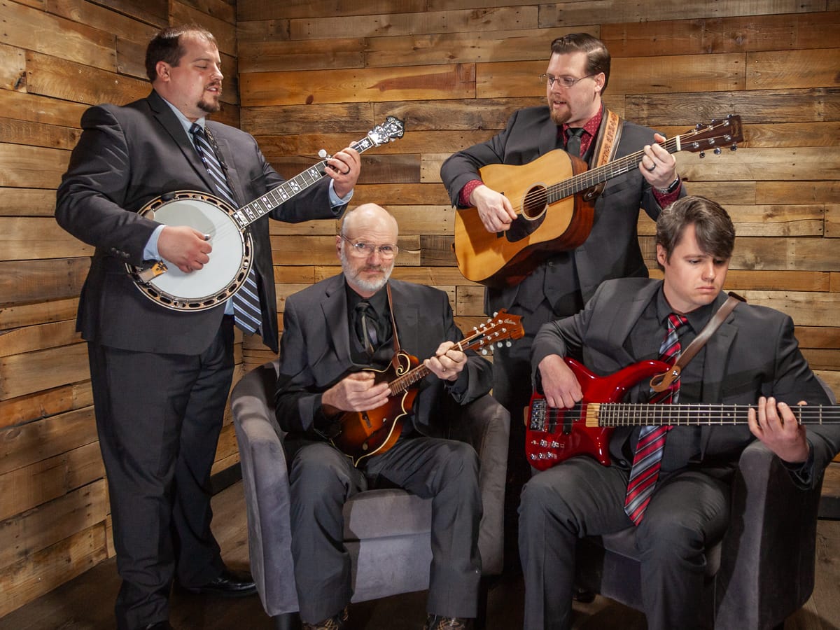 First Go 'Round — studio seated with instruments